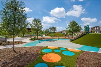 A park with a playground and trees